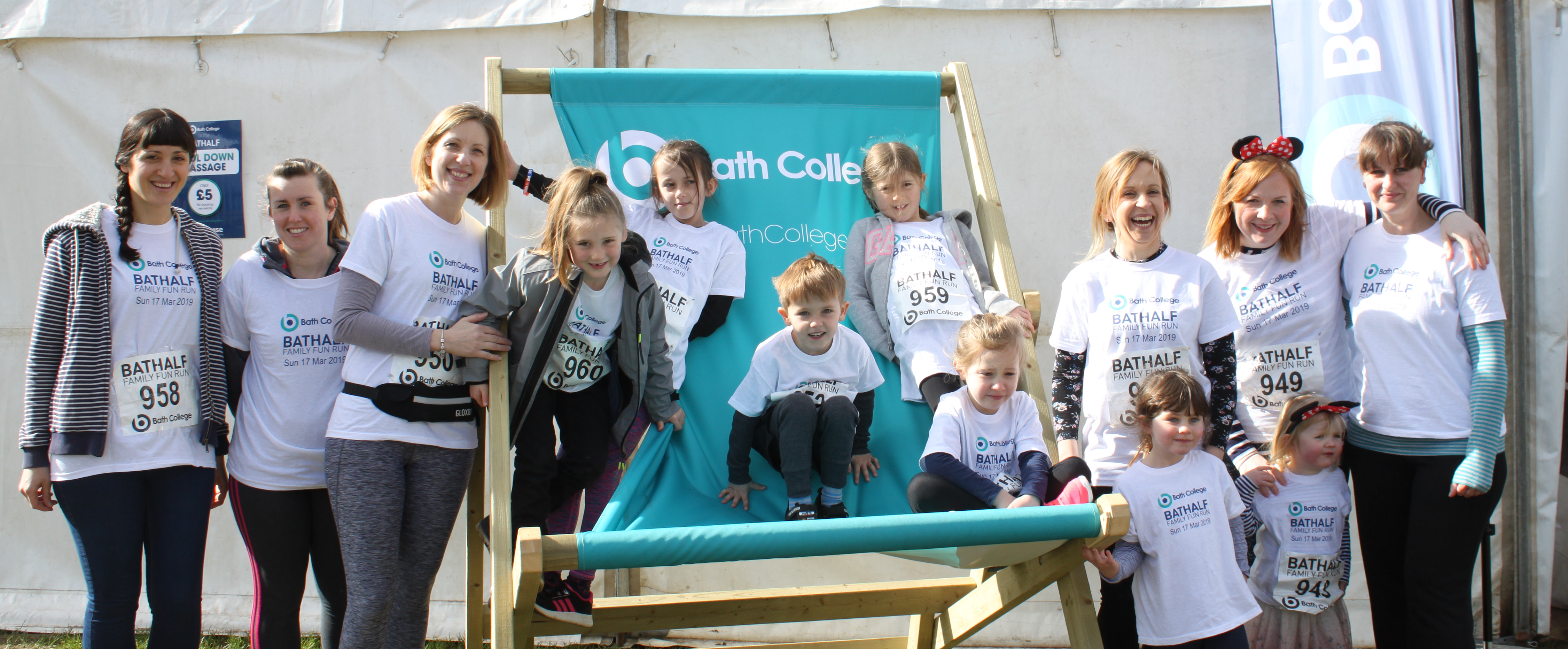 Bath College staff and their children on the deckchair after the fun run